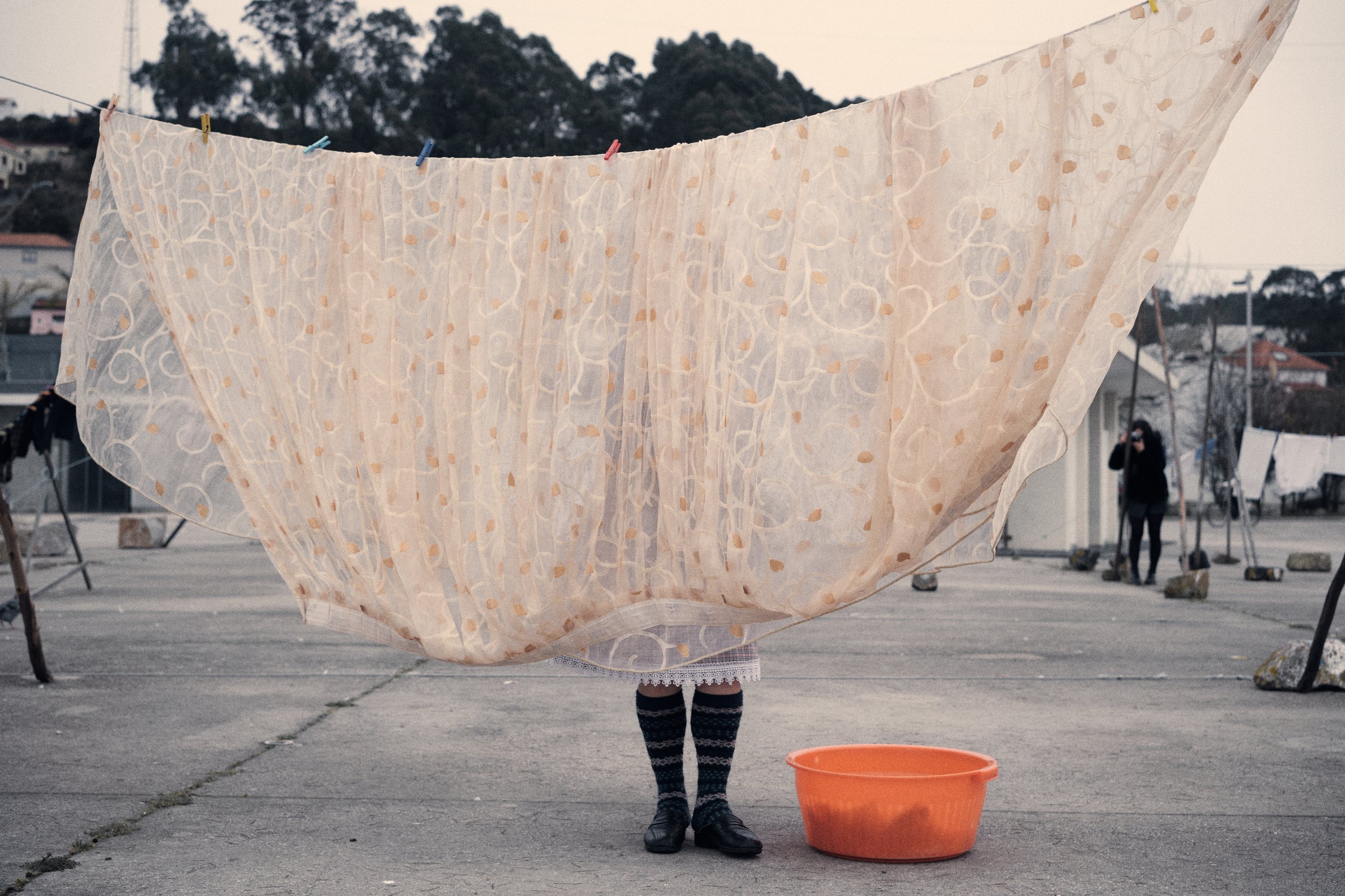 This photo was taken in a fishing village at the mouth of the Douro River, across from Porto, in a communal water tank where women wash their clothes and hang them to dry on long lines stretched between pairs of tall sticks. 🇵🇹 Afurada, Vila Nova de Gaia